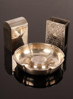 A hexagonal silver ashtray,
