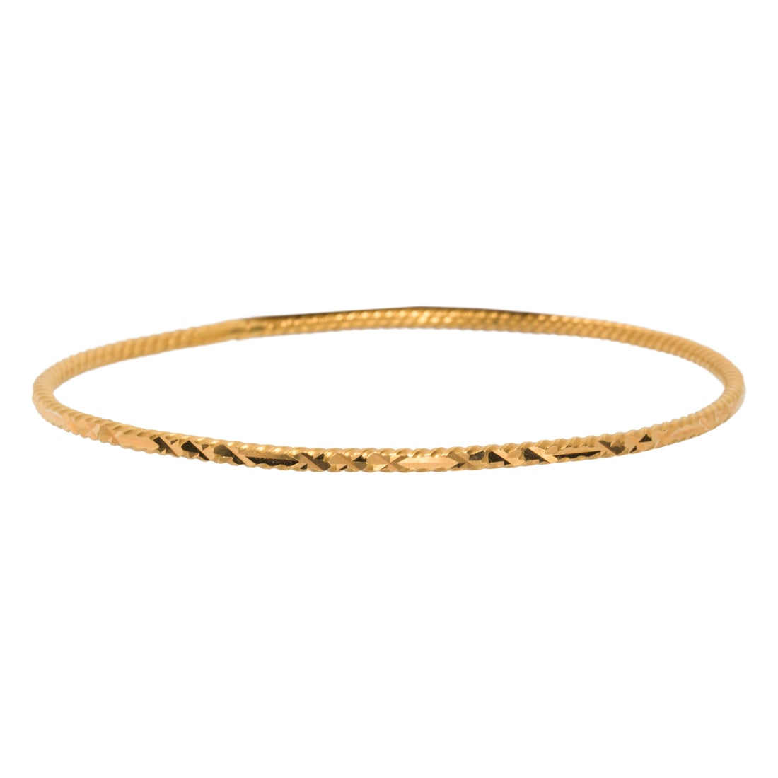 A HIGH KARAT GOLD BANGLE
