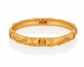 A HIGH KARAT GOLD BANGLE BRACE