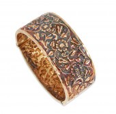 A HIGH KARAT GOLD HINGED BANGL