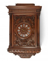 A HORNER-STYLE CARVED WOOD WAL