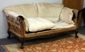 A Howard sofa on claw and ball