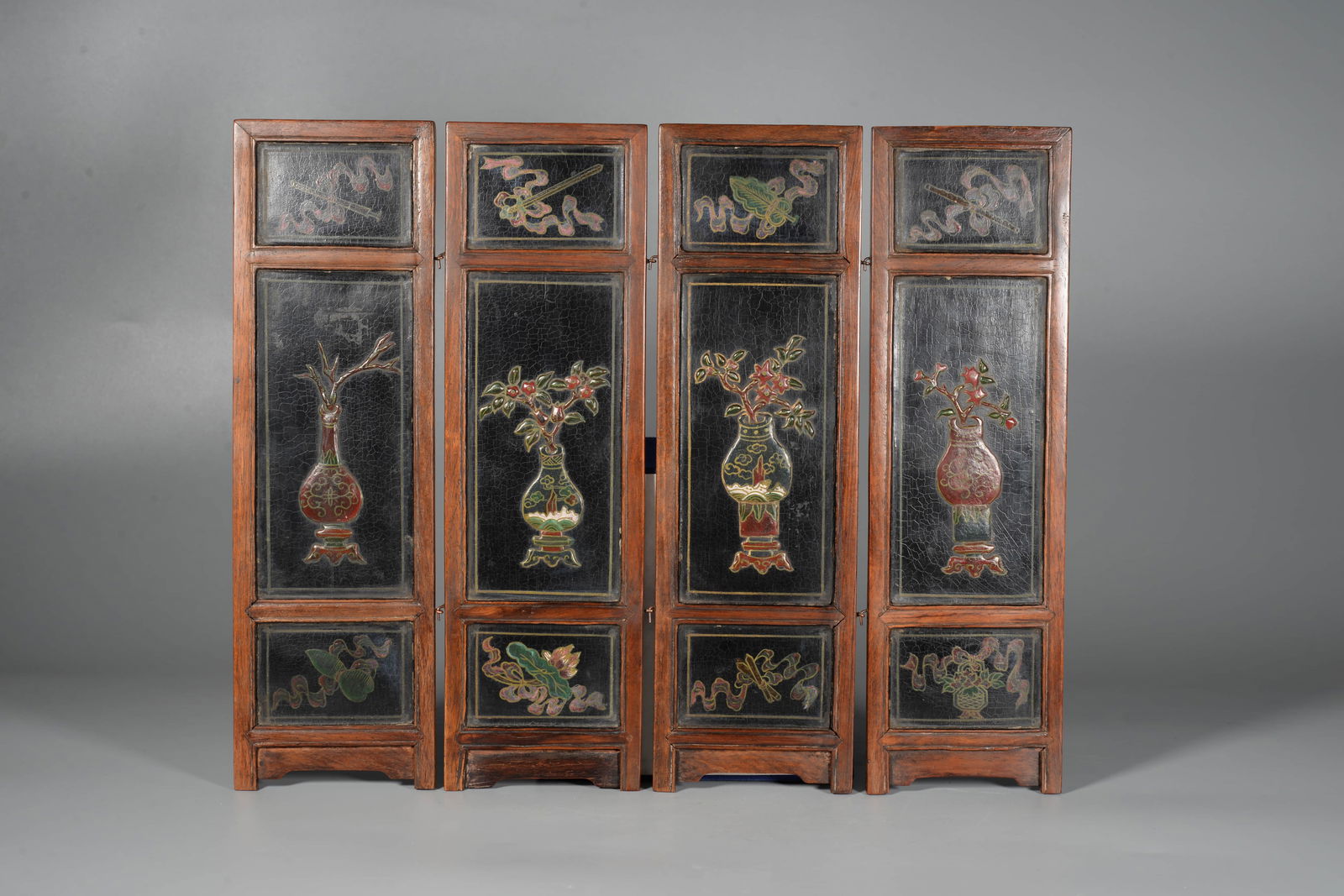 A HUANGHUALI LACQUERED 'ANTIQUES'