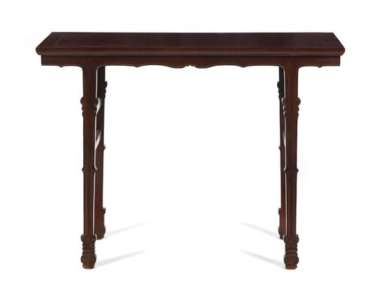 A Huanghuali Wine Table having a