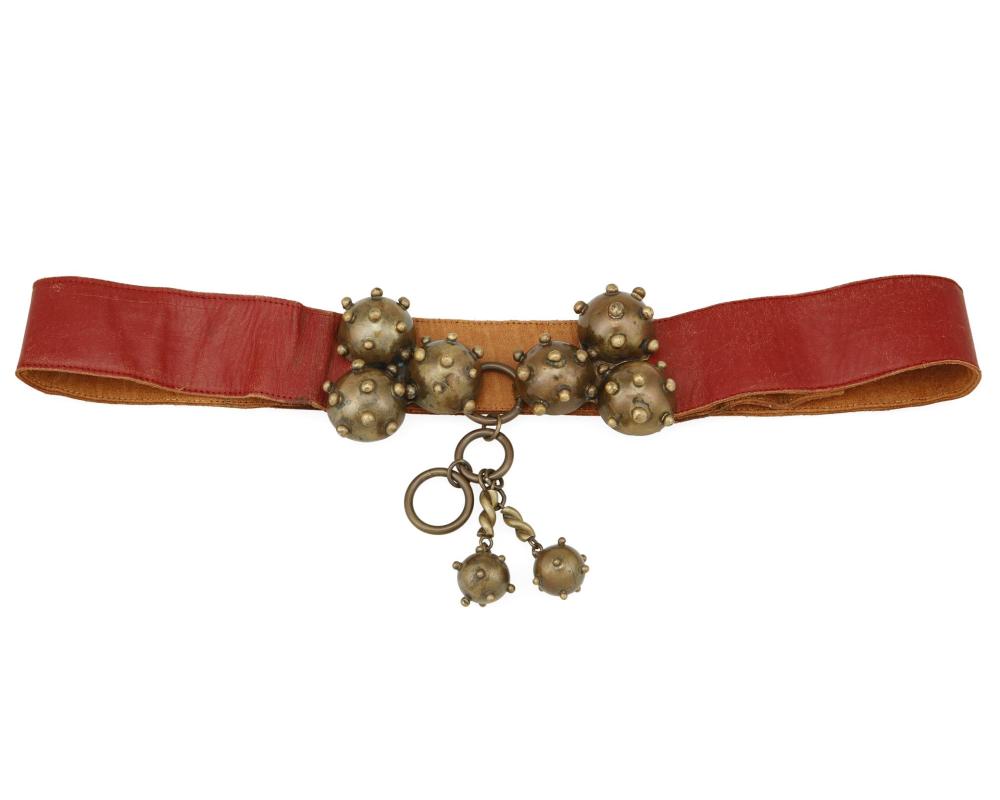 A HUBERT HARMON BRASS BELT