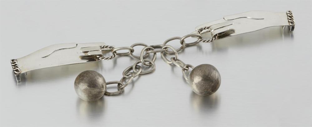 A HUBERT HARMON SILVER AND METAL