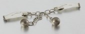 A HUBERT HARMON SILVER AND MET