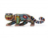 A HUICHOL BEADED WOOD JAGUARA