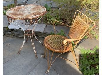 A iron patio/bistro table with a