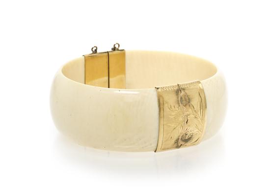 A Ivory and 14 Karat Yellow Gold