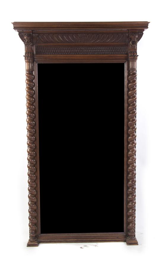 A Jacobean Mahogany Mirror having a