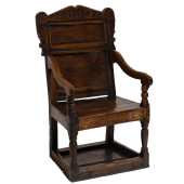 A JACOBEAN OAK ARMCHAIR<br>A J