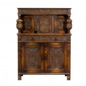A JACOBEAN STYLE CUPBOARD A Ja