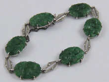 A jade bracelet set in white