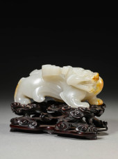 A JADE CARVING OF A MYTHICAL B