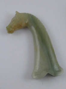 A jade curved dagger handle