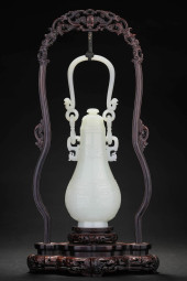 A JADE 'TAOTIE' EWER WITH ZITA