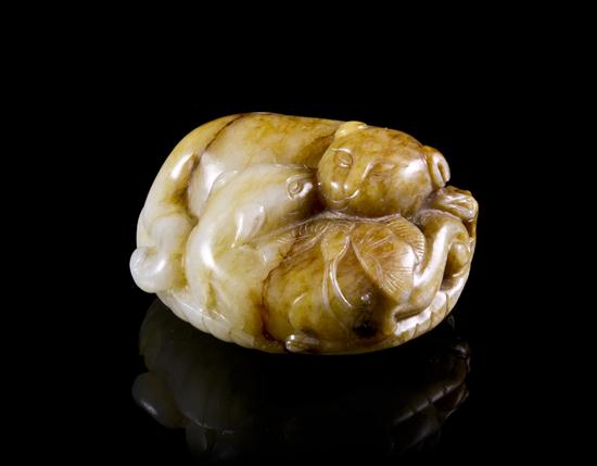 A Jade Toggle of Cats of near white