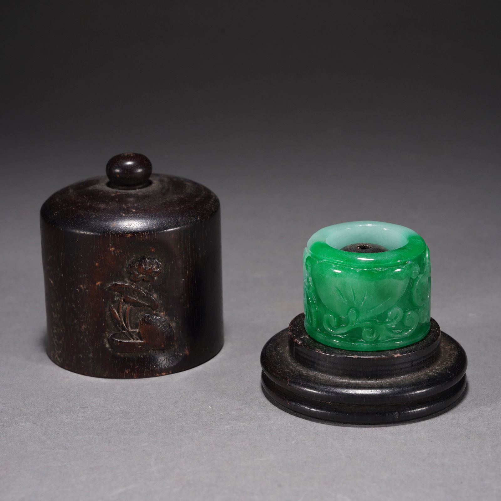 A JADEITE CARVED FLOWER ARCHERS