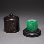 A JADEITE CARVED FLOWER ARCHER