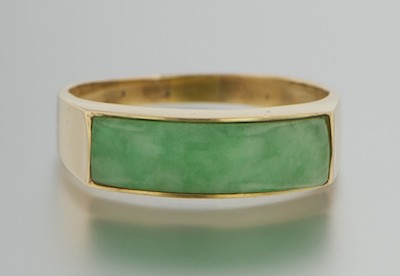 A Jadeite Saddle Ring 14k yellow