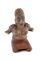 A JALISCO REDWARE FIGURE OF A