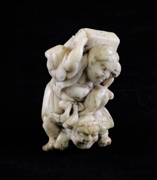 A Japanese bone netsuke of Shoki on