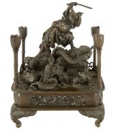 A JAPANESE BRONZE CANDLE STAND