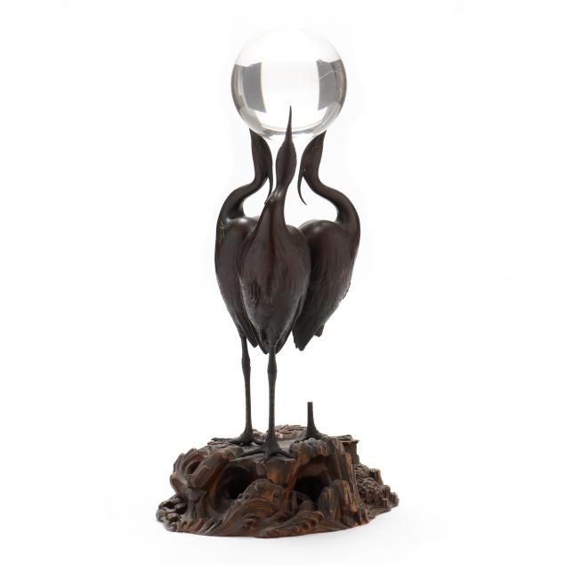A JAPANESE BRONZE CRANE SCULPTURE