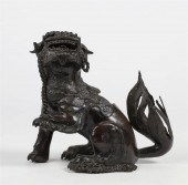 A JAPANESE BRONZE FOO DOG FORM