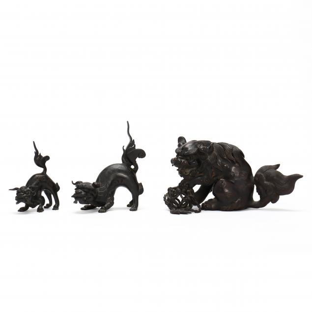 A JAPANESE BRONZE FOO LION GROUP 