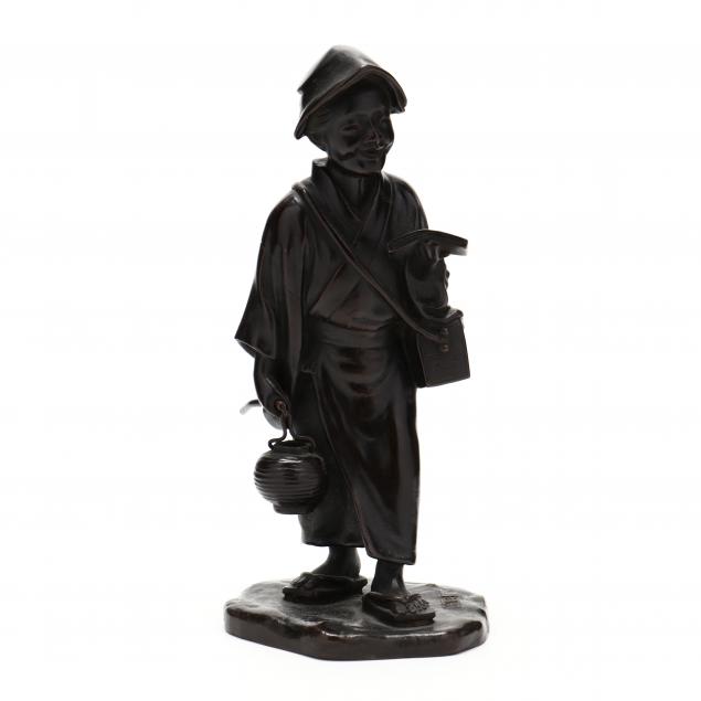 A JAPANESE BRONZE OKIMONO OF AN OLD