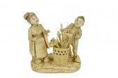 A JAPANESE CARVED GROUP OF FLO
