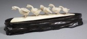 A Japanese carved ivory group