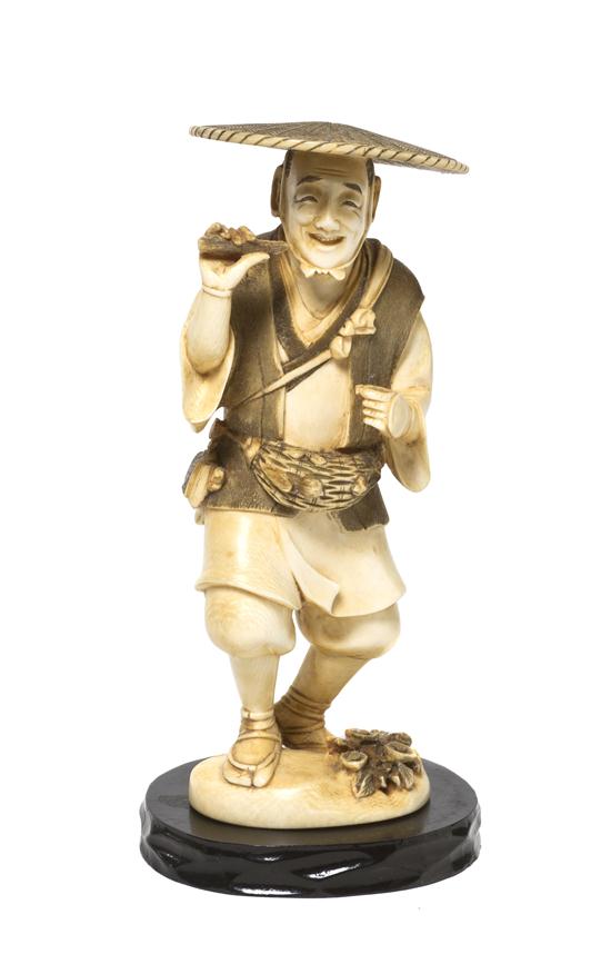 A Japanese Carved Ivory Okimono