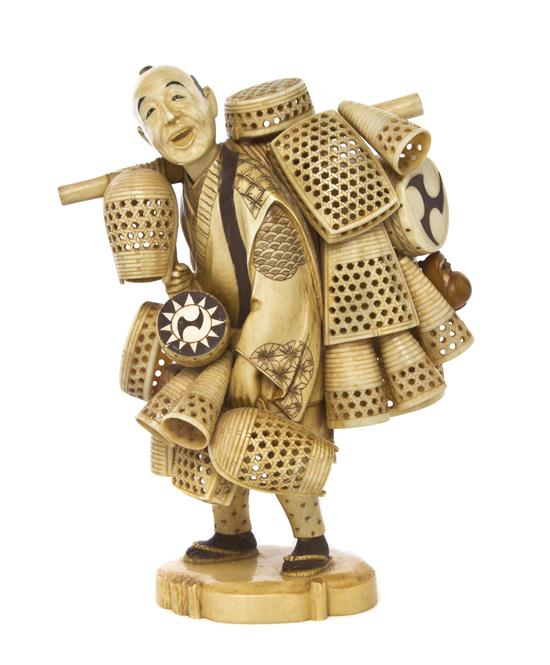 A Japanese Carved Ivory Okimono