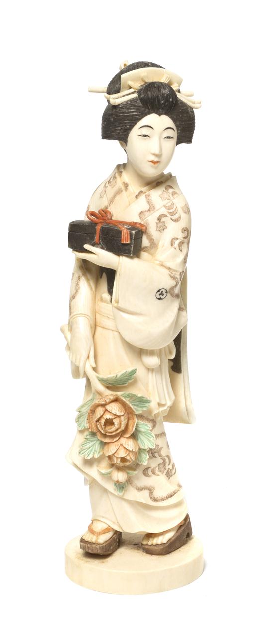 A Japanese Carved Ivory Okimono