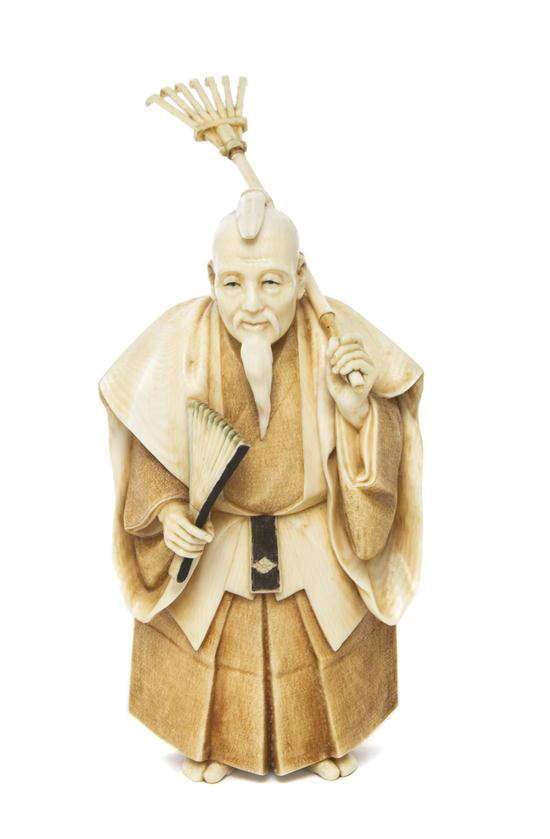 A Japanese Carved Ivory Okimono