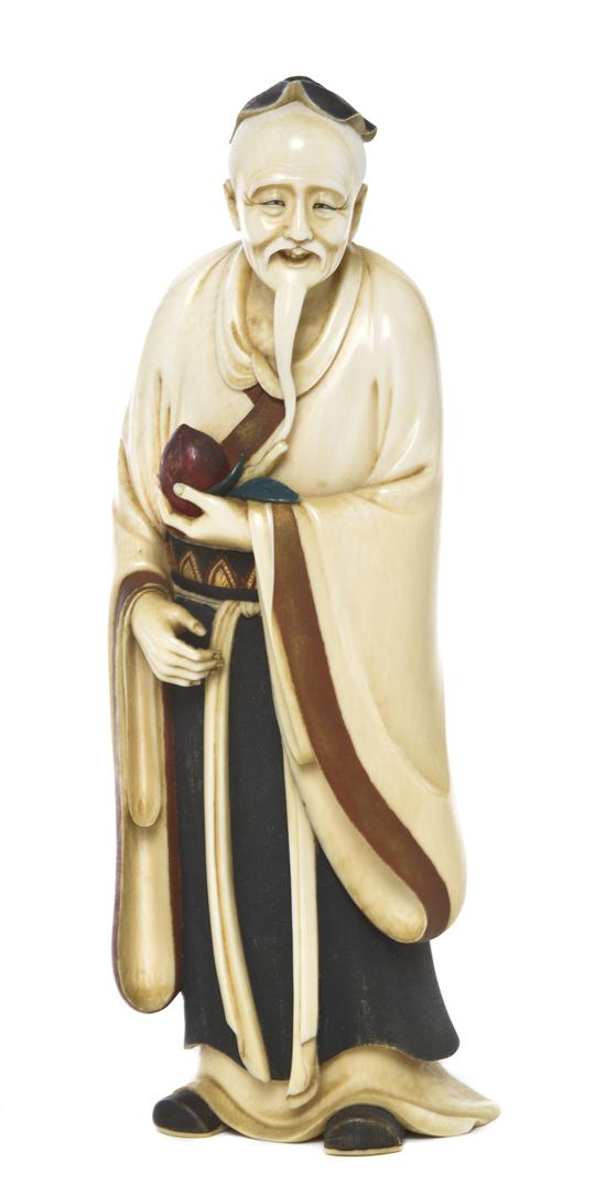 A Japanese Carved Ivory Okimono