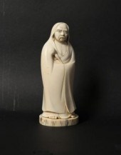 A Japanese carved ivory okimon