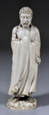 A Japanese carved ivory standi