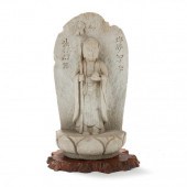 A JAPANESE CARVED STONE SCULPT