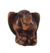 A JAPANESE CARVED WOOD NETSUKE