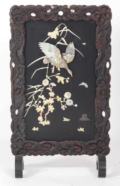 A Japanese fire screen decorated