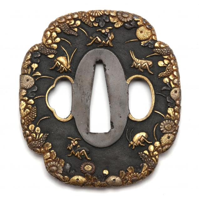 A JAPANESE IRON SHAKUDO TSUBA