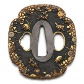 A JAPANESE IRON SHAKUDO TSUBA