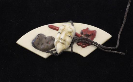A Japanese ivory and lacquer