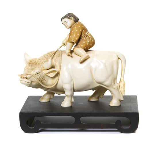 A Japanese Ivory Carving of a Boy