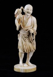 A Japanese ivory figure of a f