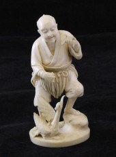 A Japanese ivory figure of a c
